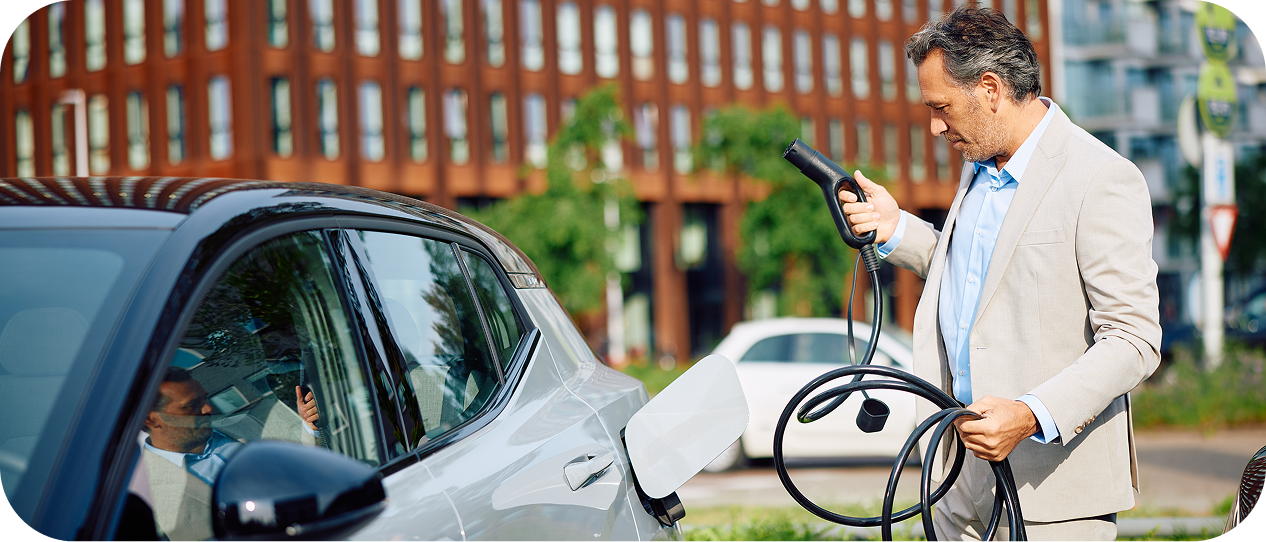 A man public charging his EV at a charge point operator