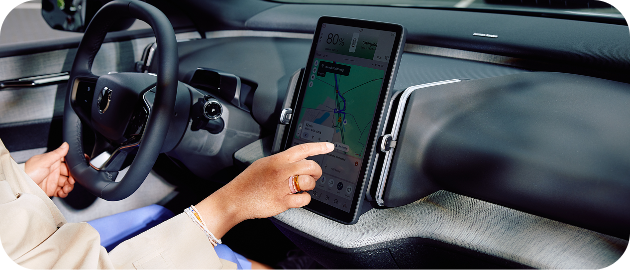 Woman driving an EV, roaming to the next charge point in Portugal
