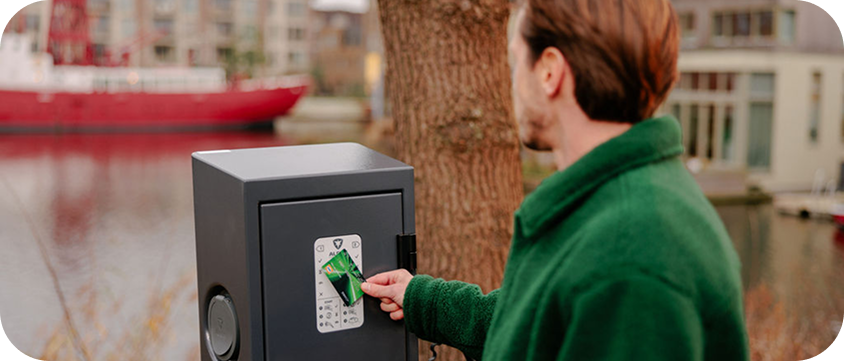 Man paying at a charge point operator's payment terminal